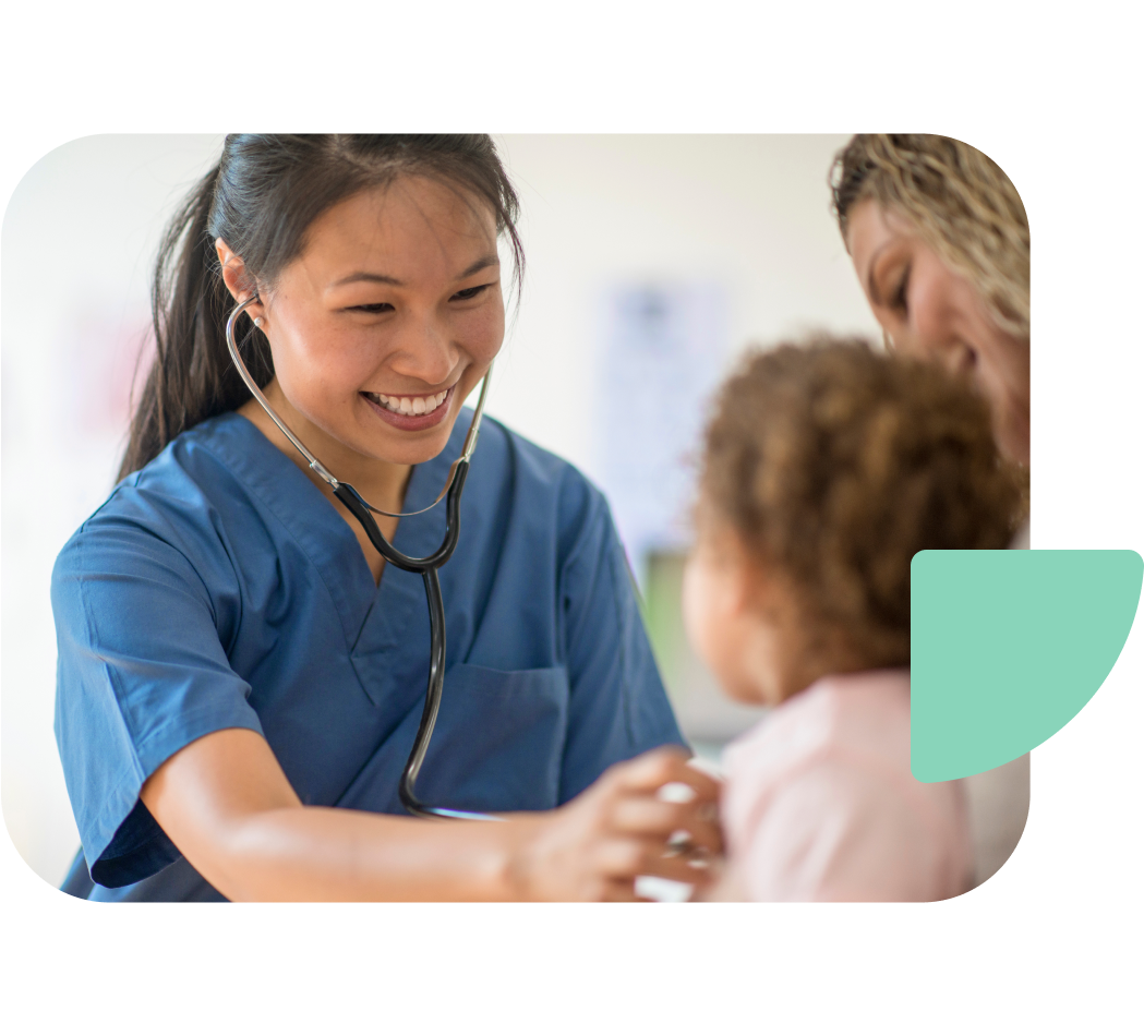 Smiling traveler listens to a child's breathing through her stethoscope.